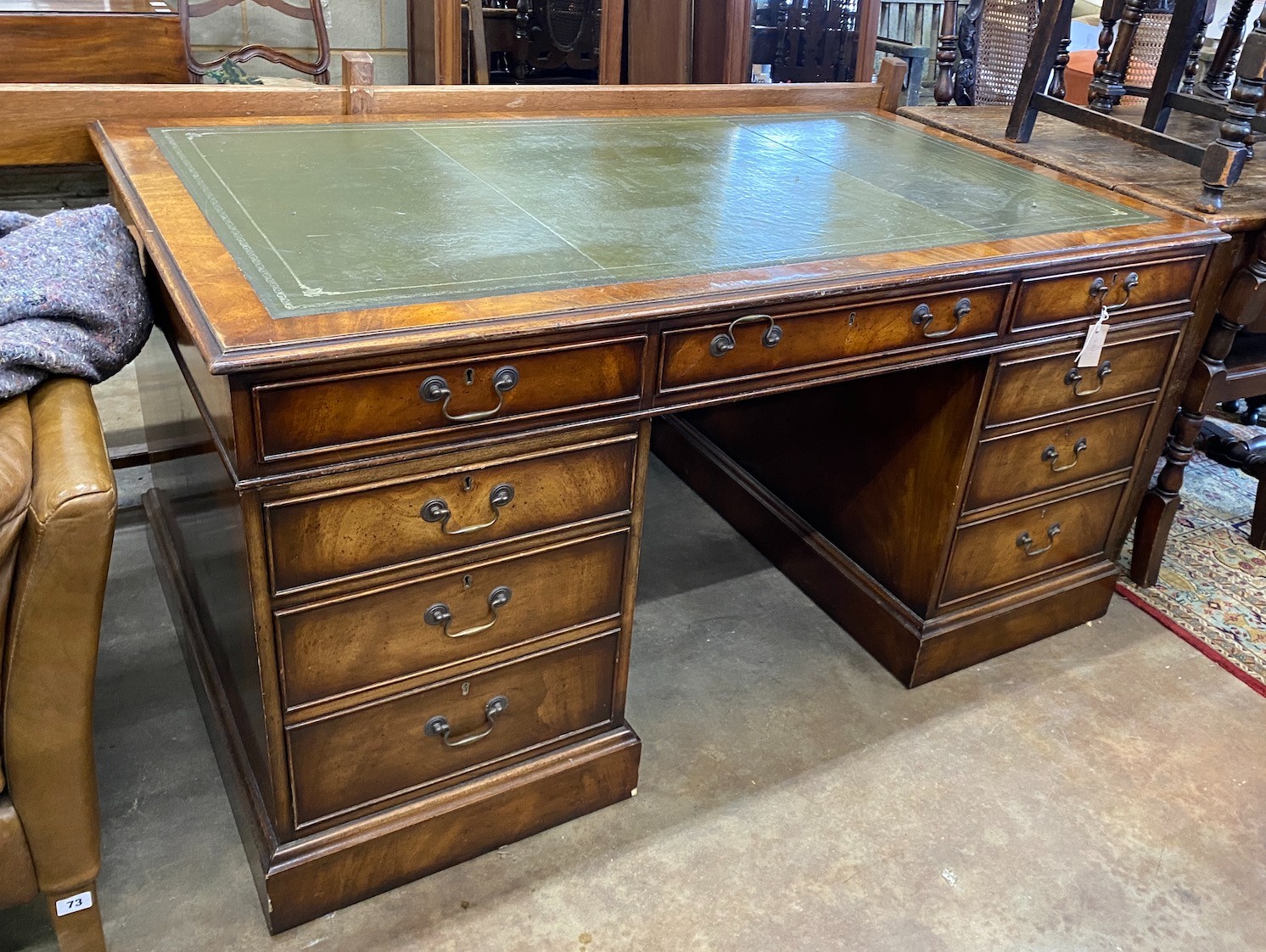 A reproduction George III style mahogany pedestal partner's desk, width 152cm, depth 91cm, height 76cm *Please note the sale commences at 9am.